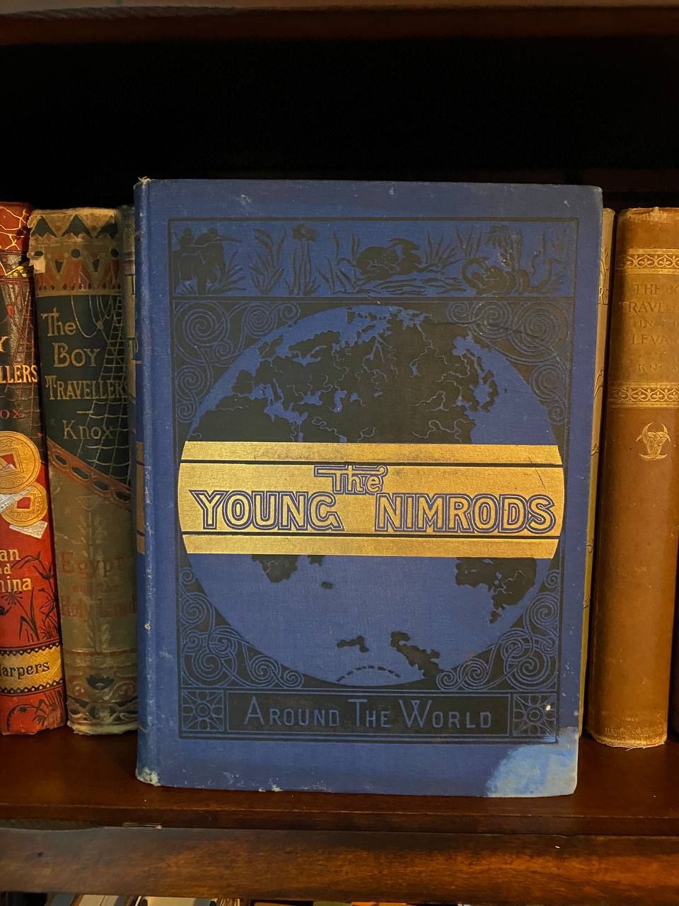 The physical copy of The Young Nimrods Around the World in Drew's home library